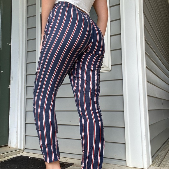 red and white vertical striped pants